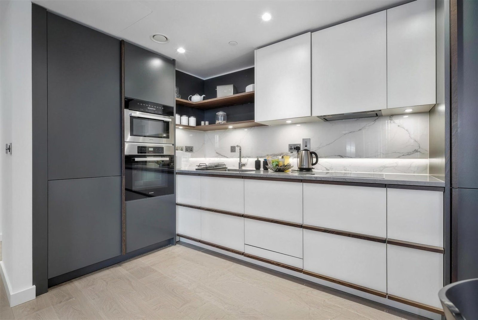 Kitchen with walnut trims and marble splashback
